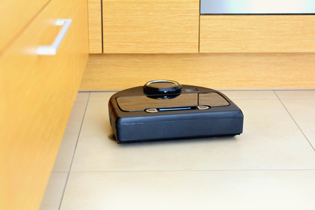 A robot technology vacuum cleaner cleaning homeの写真素材