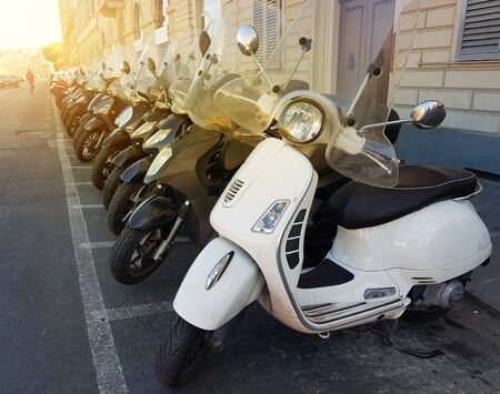 Row of motor scooters in Florence street. Italyの写真素材