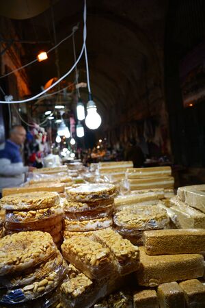 Assorted halva and turkish sweet snacks on street market, selective focusの写真素材