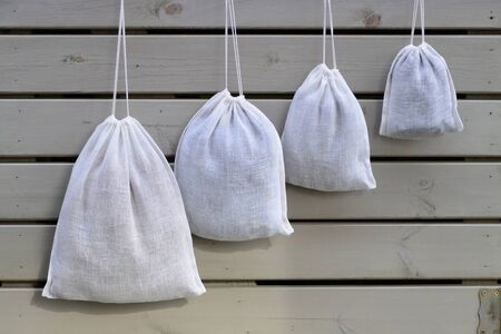 Reusable zero waste linen mesh produce bags hangingの写真素材
