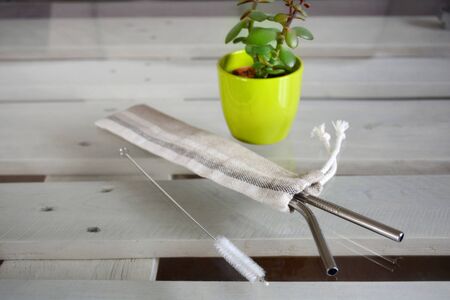 Reusable zero waste stainless steel straw set and linen pouch, close-up viewの写真素材
