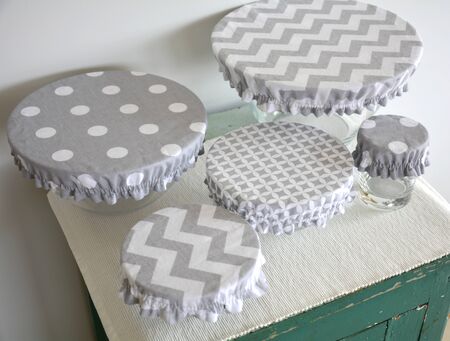 Set of bowls covered with reusable zero waste fabric cloth coversの写真素材