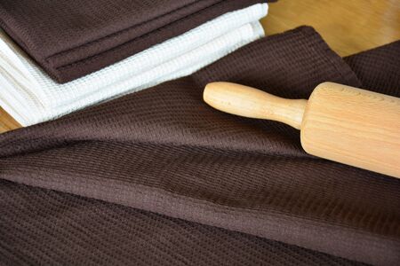 Waffle weave kitchen or hand towels on wooden table. Home textileの写真素材
