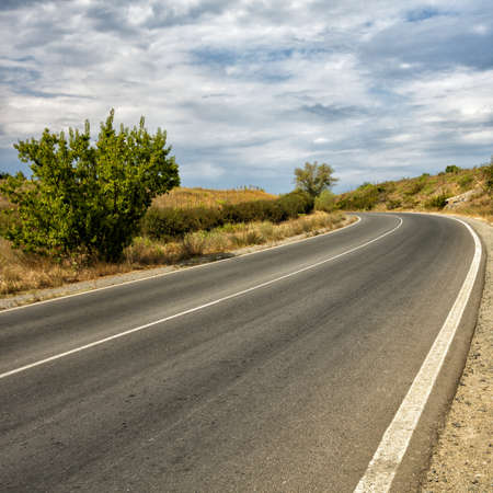 Road among a huge amount of sandの写真素材