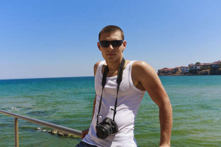 Photographer on sea background and coastの写真素材