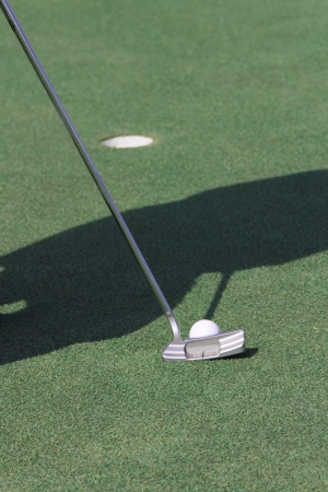 putt golf into a holeの写真素材