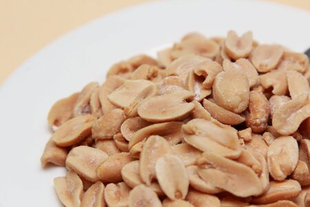 roasted peanuts with salt on a plate