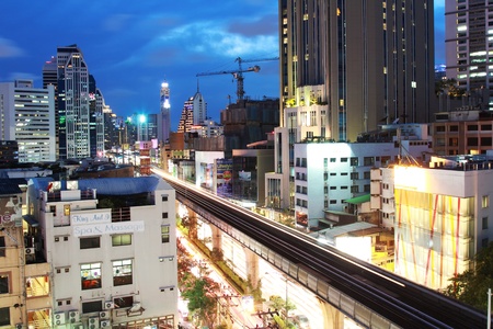 BANGKOK,THAILAND - APRIL 25: Night scene of Bangkok at Asoke sky train station on APRIL 25,2013. Asoke station at Sukhumvit Rd. is one of the most crowded and worst traffic jam in Thailand in rush hour.のeditorial素材
