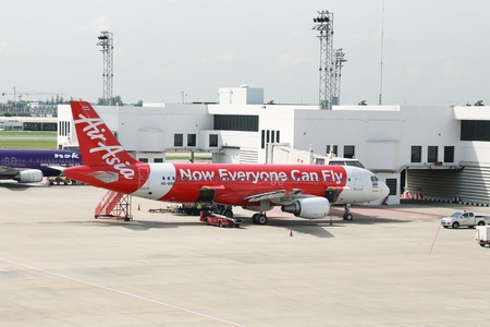 BANGKOK  THAILAND JUNE 24 2013: Air Asia plane ready for boarding in Bangkok Thailand on 24 June...
