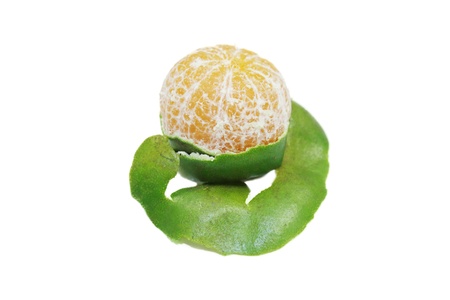 isolated orange with peeled spiral skinの写真素材