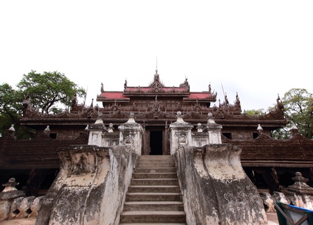 carved wooden statue at Shwenandaw Kyaung Templeの写真素材