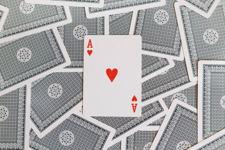 background of cards with red heart of ace on the top