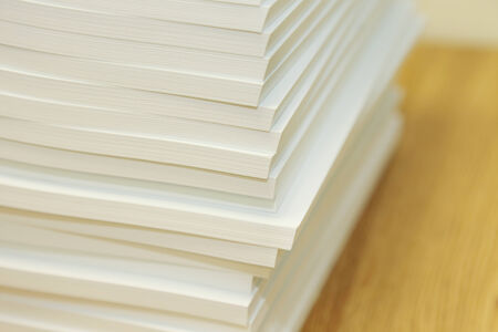 pile of books on the wooden table