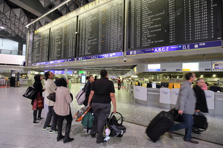 FRANKFURT, GERMANY - OCTOBER 17:, 2014: passengers walk to the terminal at the Frankfurt Airport, Germany on October 18, 2014.Frankfurt handled 57.5 million passengers annually.のeditorial素材