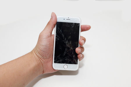 BANGKOK, THAILAND -NOVEMBER 16, 2014: hand hold the new apple iphone6 with broken sceen on 16 November 2014 in Bangkok Thailand.のeditorial素材