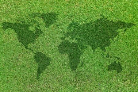 background of world map on green grass fieldの写真素材