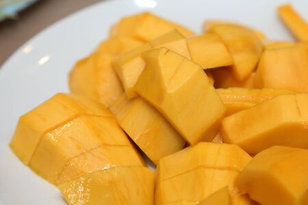 sliced mango on a plateの写真素材