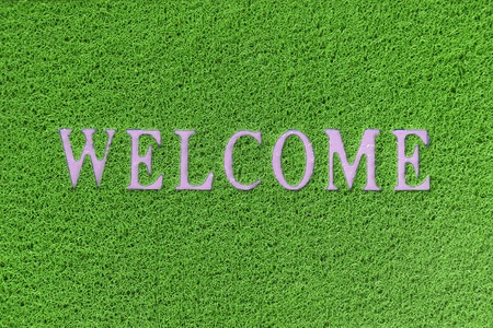 background of green welcome carpetの写真素材