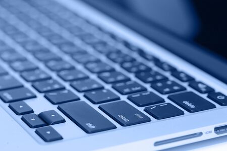closeup image of laptop keyboard on the table