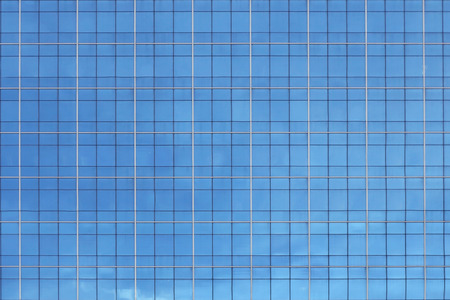 background of glass windows of modern office building