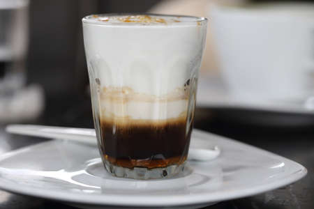 close-up on hot caramel macchiato coffeeの写真素材