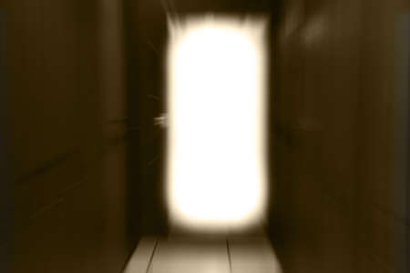 motion blurred of path to the light from the door