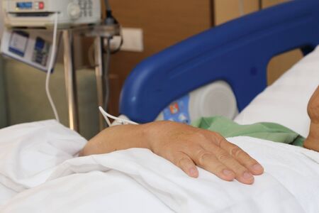 close-up on the patient sleeping in the hospital bedの写真素材