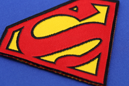 BANGKOK, THAILAND -JULY 3, 2016: Superman Logo on Blue Fabric on July 3,2016