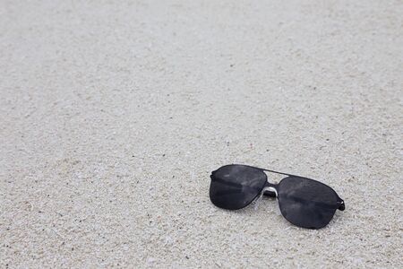 sunglasses on the sandの写真素材