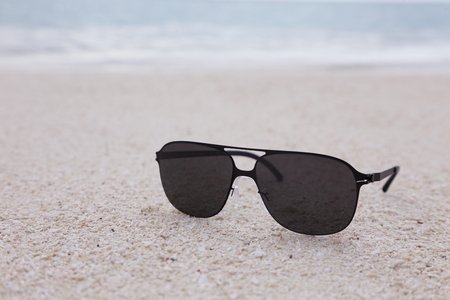 sunglasses on the sandの写真素材