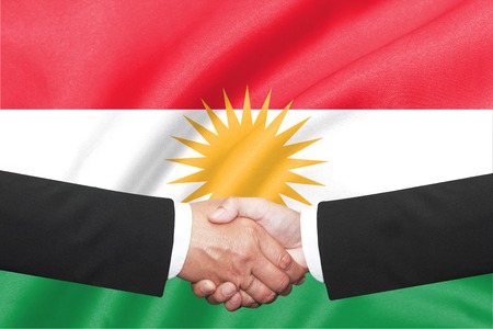 two businessman handshake over  kurdistan flagの写真素材