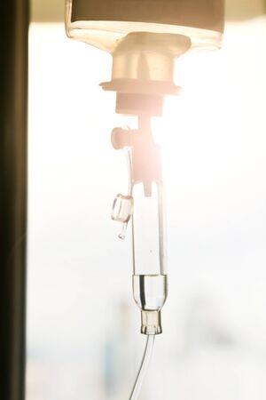 Close up saline solution drip for patient and infusion pump in hospital