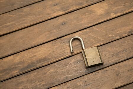 padlock on the wooden tableの写真素材