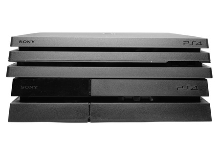 BANGKOK, THAILAND - JANUARY 15, 2017:The New PlayStation 4 Pro on the Old PS4 Console on January 15, 2017. in Bangkok Thailand.のeditorial素材