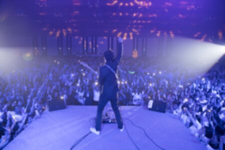 blurred background of the vocal singing on a stage in a concertの写真素材