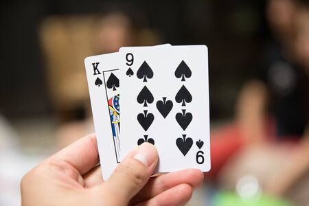 hand holding cards playing card gameの写真素材