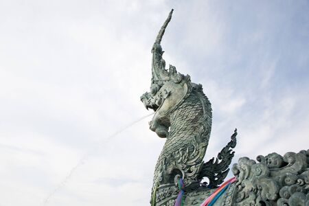 Naga statue spray water to the sea in songkhla provinceの写真素材