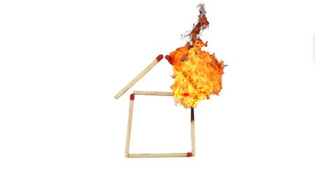 matchstick in home shape with fireの写真素材