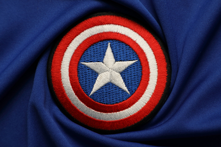 BANGKOK, THAILAND -MAY 26: Captain America Logo on Blue Fabric on May 26,2017のeditorial素材