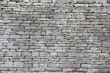 background of old stone wall textureの写真素材