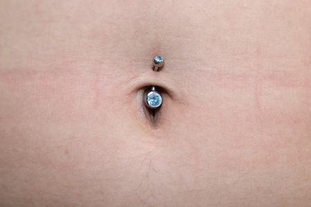 woman with piercing in the navel