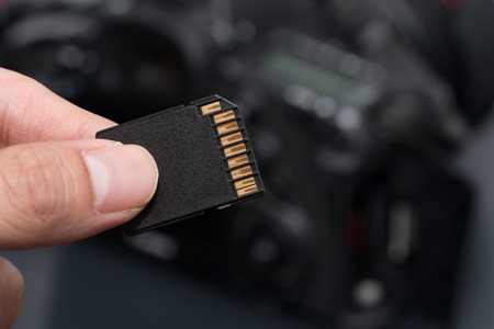 hand hold SD card uhs i against the camera
