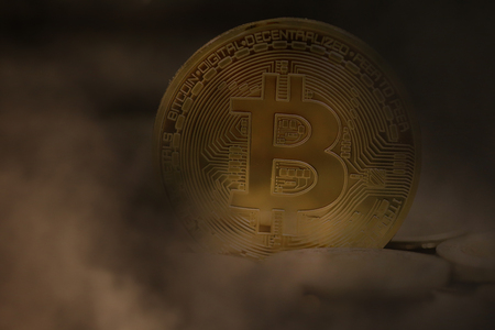 golden bitcoins in a mysterious smokeの写真素材