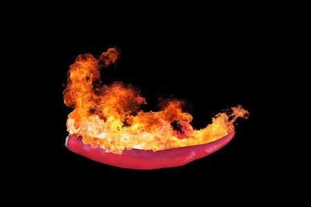isolated burning thai red chilli with fire flame on black backgroundの写真素材
