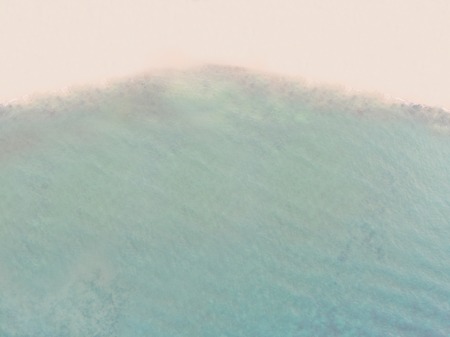 Aerial View of Sandy Beach and Blue Seaの写真素材