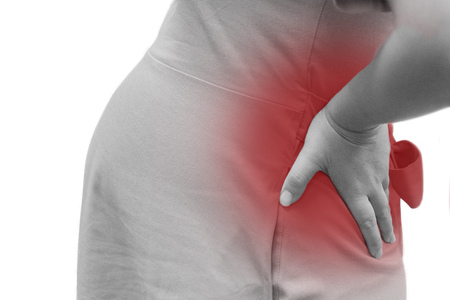 Isolated Pregnant woman grab her back with pain from backache symtom