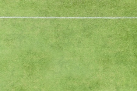 Aerial view of white stripe line on the green football field