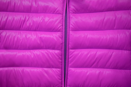 Close-up on pink puffer jacket textureの写真素材