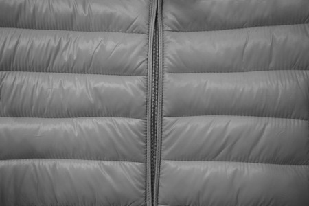Close-up on grey puffer jacket textureの写真素材
