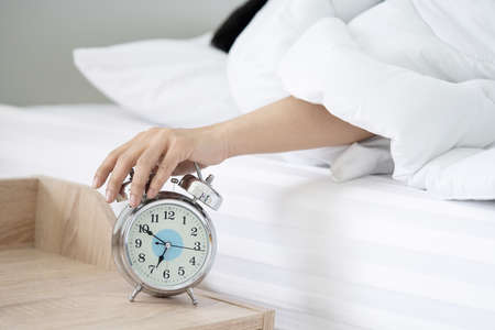 Close-Up on a Man Hand Try to Stop the Alarm of the Clock in the Morning